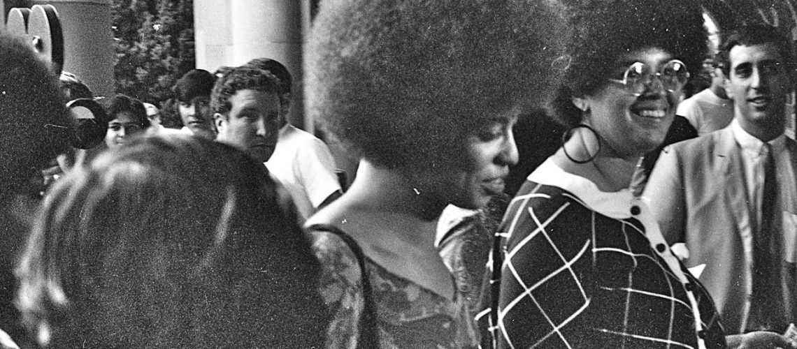 GeorgeLouis-Angela_Davis_enters_Royce_Hall_for_first_lecture_October_7_1969