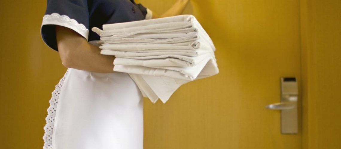 Detail of chambermaid carrying linen